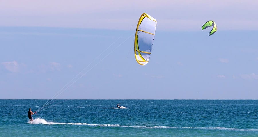 Two men windsurfing on the ocean in Orchid Florida