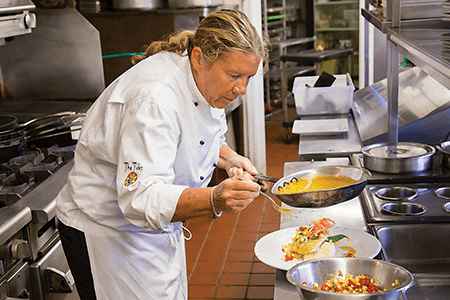 Dining at Orchid Island Vero Beach The chef cooking up something delightful in the kitchen at Orchid Island Golf and Beach Club in Vero