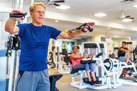 Fitness Center at Orchid Island Man works out at the Orchid Island Fitness Center