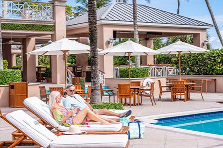 Orchid Island Poolside couple lounging poolside at orchid island